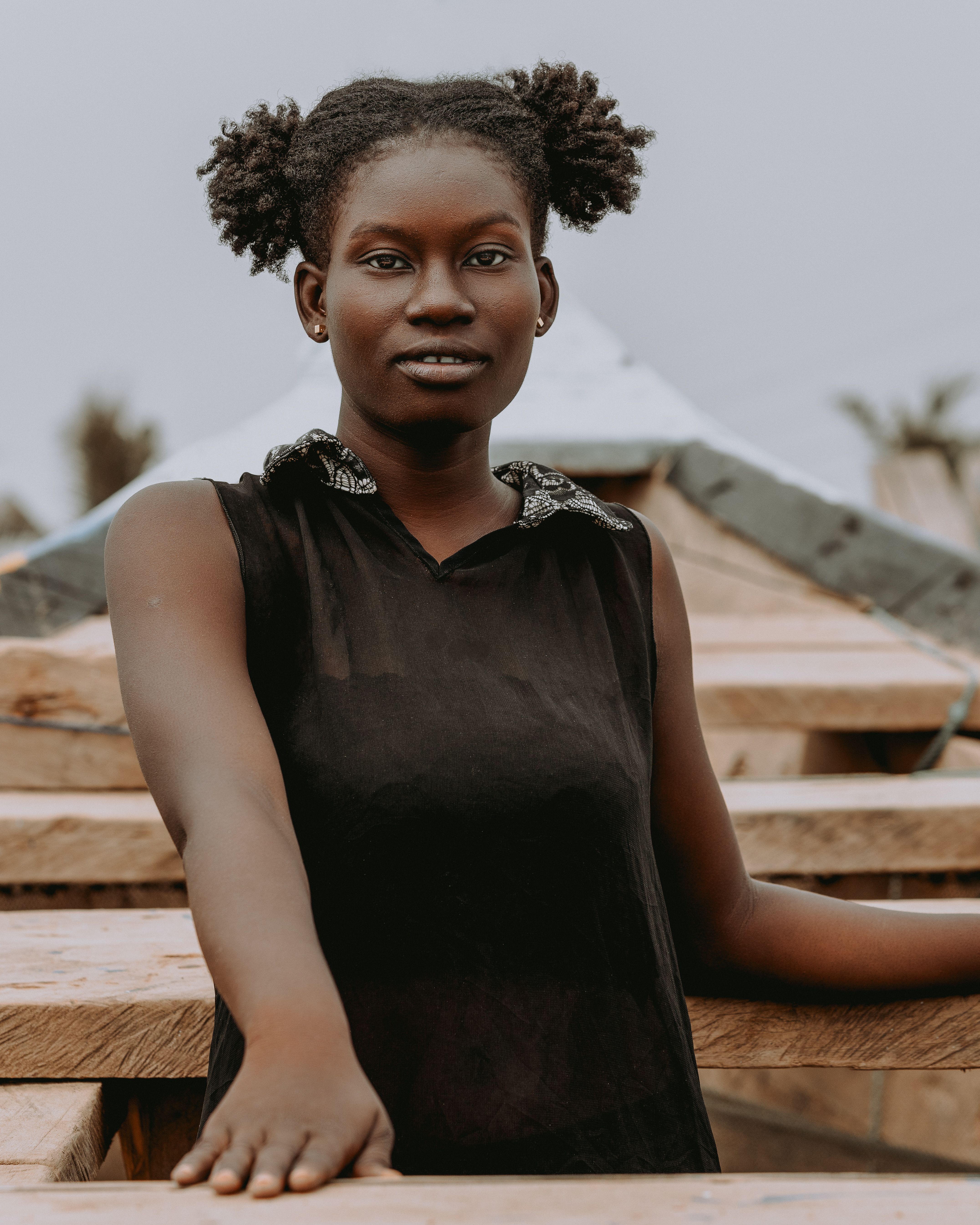 African Woman Posing Outdoors in Casual Fashion · Free Stock Photo