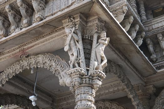 Detailed stone carvings on an ancient temple facade showcasing heritage architecture and artistry.