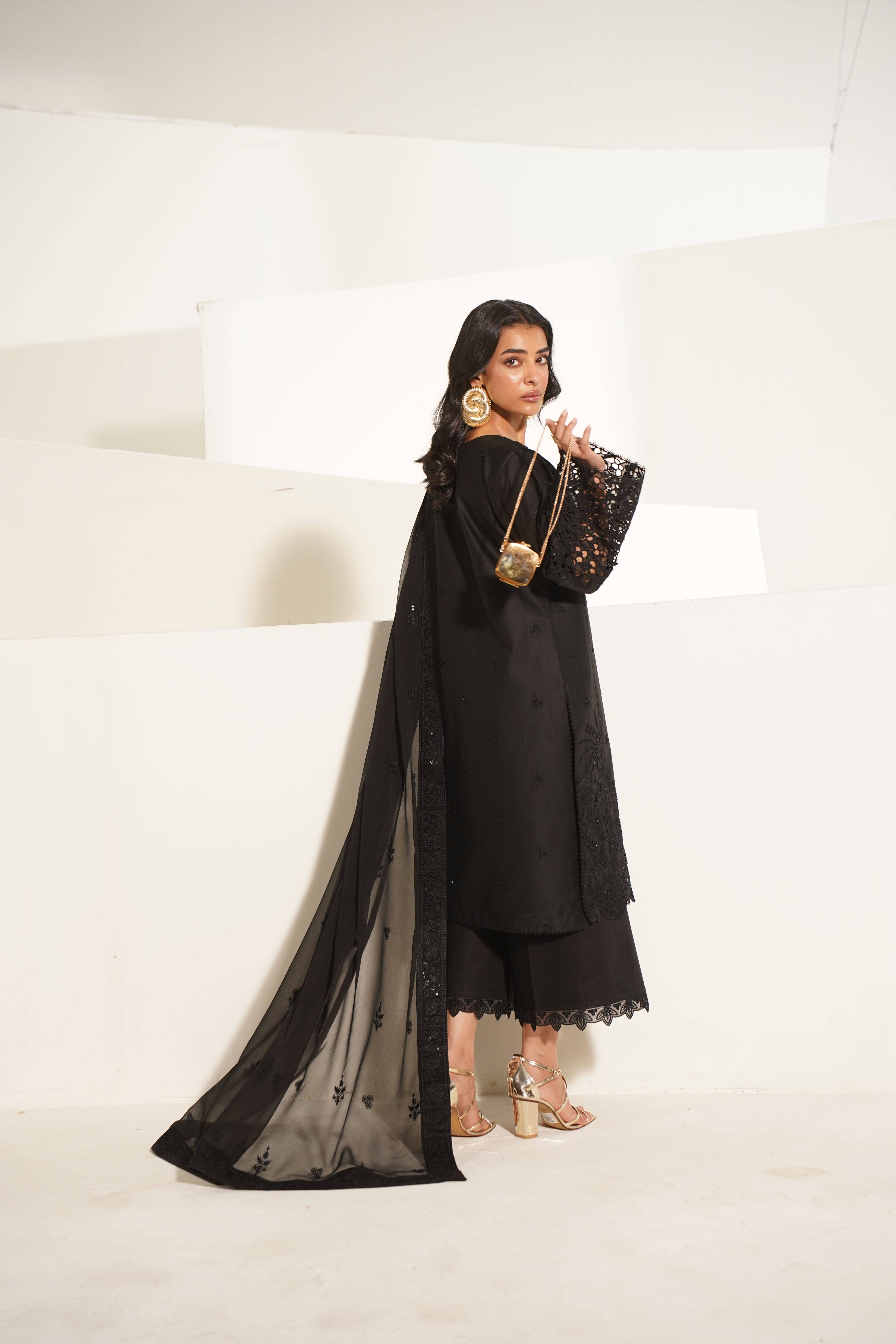 Elegant Eastern Fashion Model in Black Outfit · Free Stock Photo