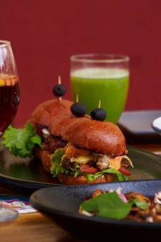 Delicious gourmet burgers served with healthy drinks at a Mexican cafe.
