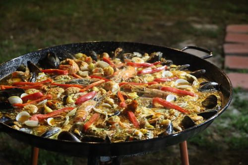 Free A large traditional seafood paella being cooked outdoors in Florida. Stock Photo
