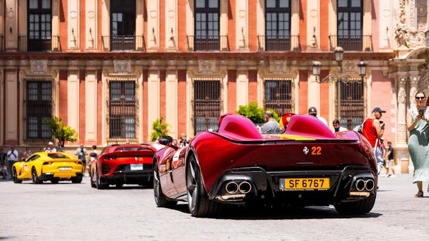 Exotic sports cars gather at a historic plaza, attracting admiration from bystanders.
