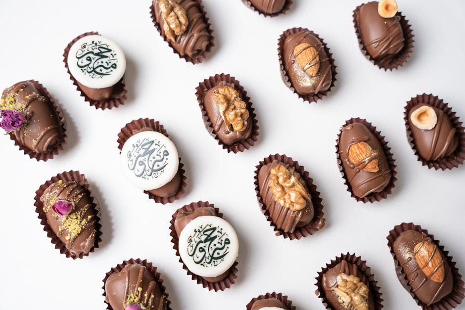 A flat lay of luxurious Arabic chocolate sweets with nuts, perfect for festive occasions.