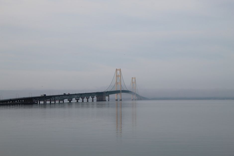 A vehicle driving across the Mackinac Bridge following proper Mackinac Bridge safety protocols.