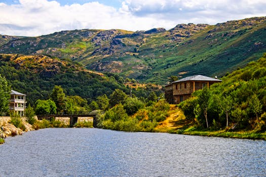 Picturesque view of a river and bridge with lush hills in O Porto, Galicia, España.