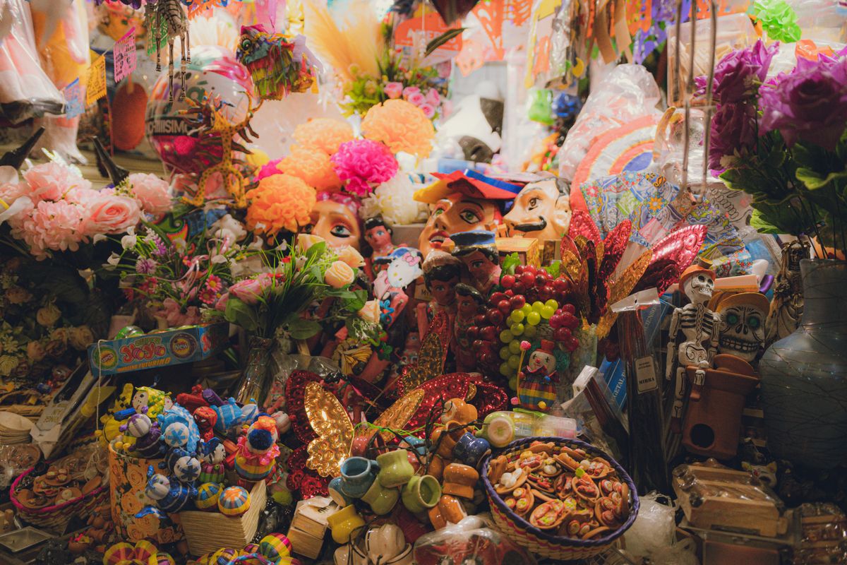 Vibrant stall in Guanajuato market showcasing traditional Mexican crafts and decorations.