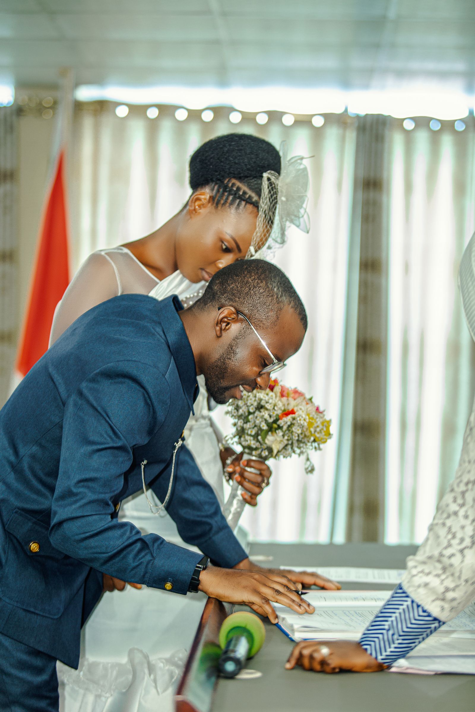 Couple signing their marriage record