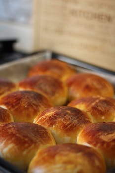 Close-up of homemade golden brown dinner rolls fresh from the oven.