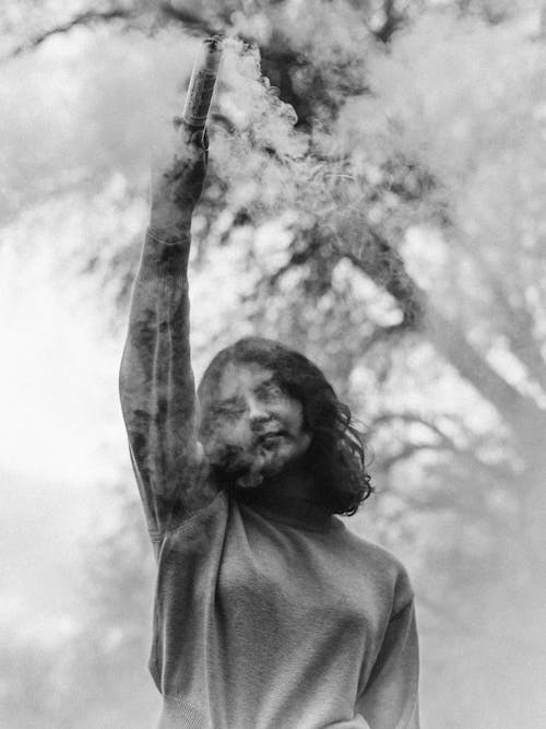 Woman Holding Smoke Bomb
