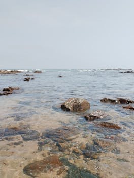 Tranquil view of rocky shoreline meeting the Atlantic Ocean in Casablanca, Morocco.