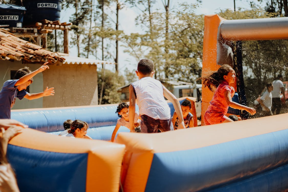 Toddlers on Inflatable Play Pad