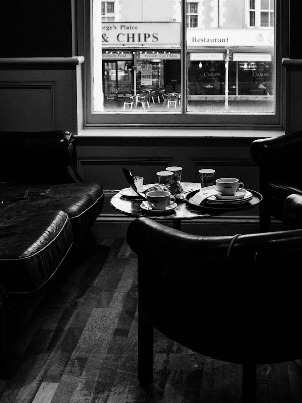 Grayscale Photography Of Inside A Coffee Shop