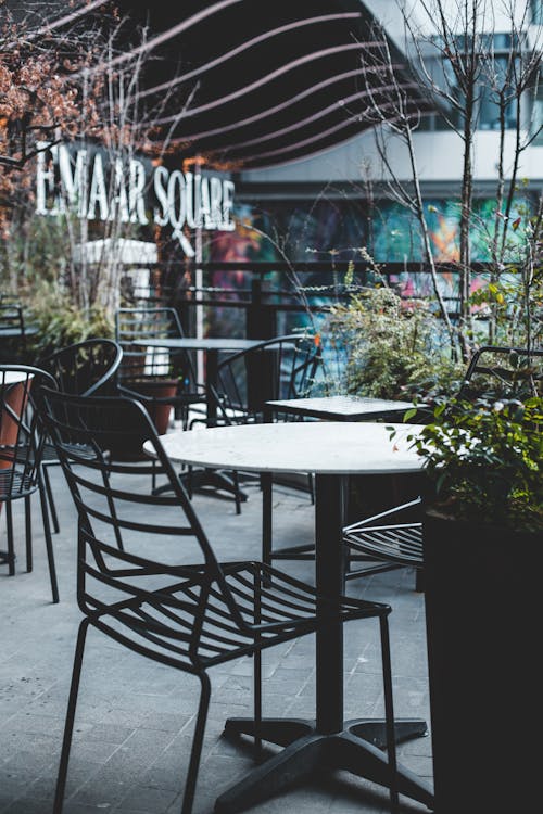 Free Tables placed on street cafe in daytime Stock Photo