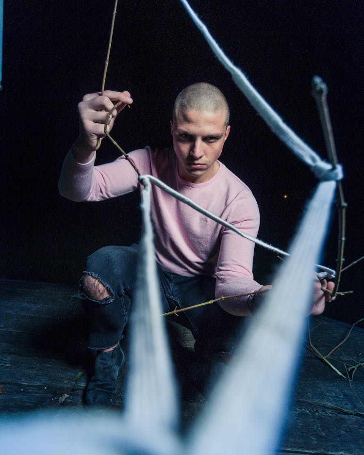 Photo Of Man Holding Black Wire