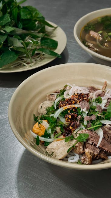 Delicious Vietnamese pho served with fresh herbs and spices