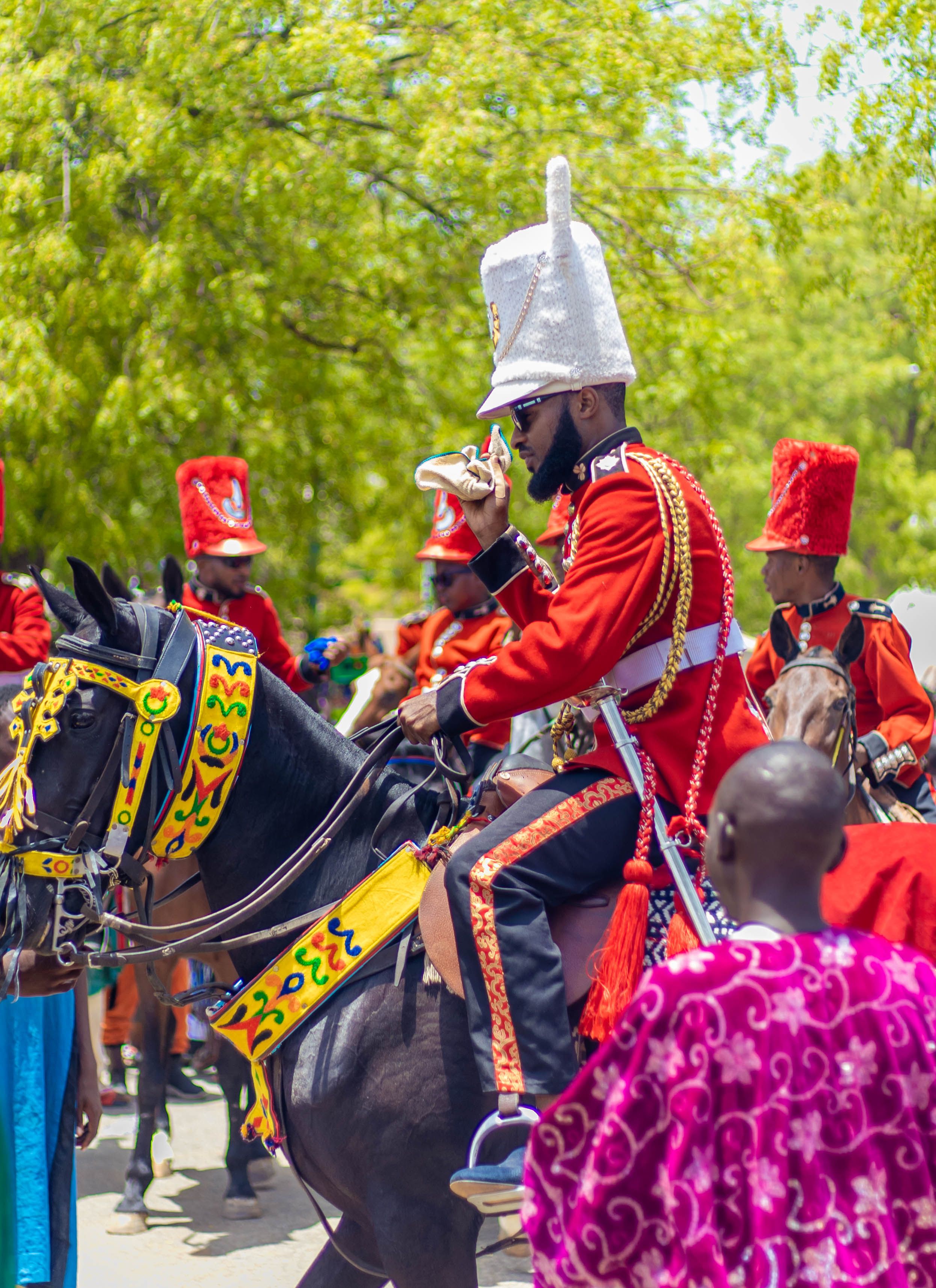 Vibrant Parade with Colorful Costumed Riders · Free Stock Photo