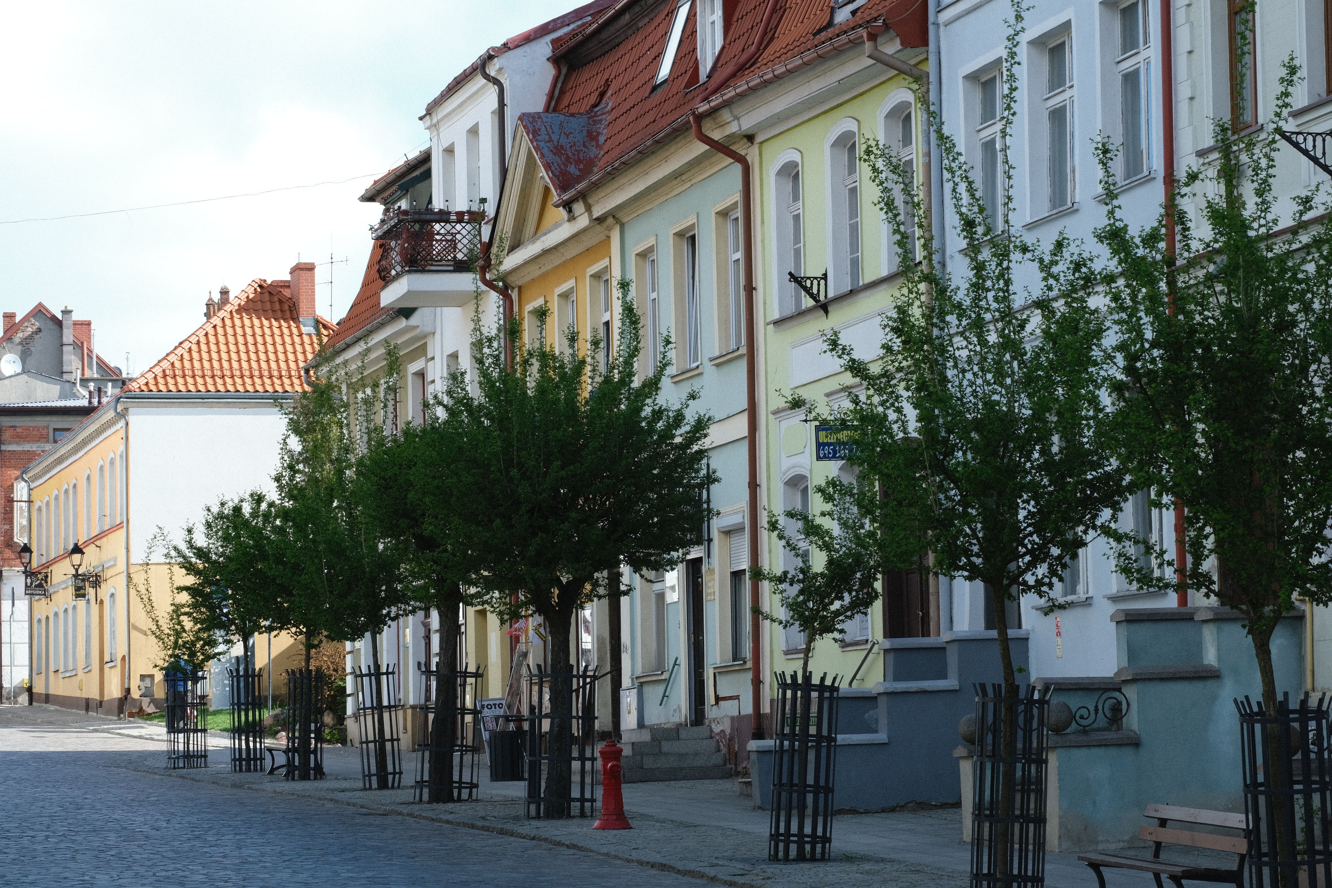 Street view in Vilnius, Lithuania, showing mobile operator stores like Telia and Tele2