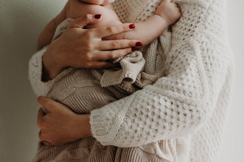 Free Mother Holding Her Baby Stock Photo