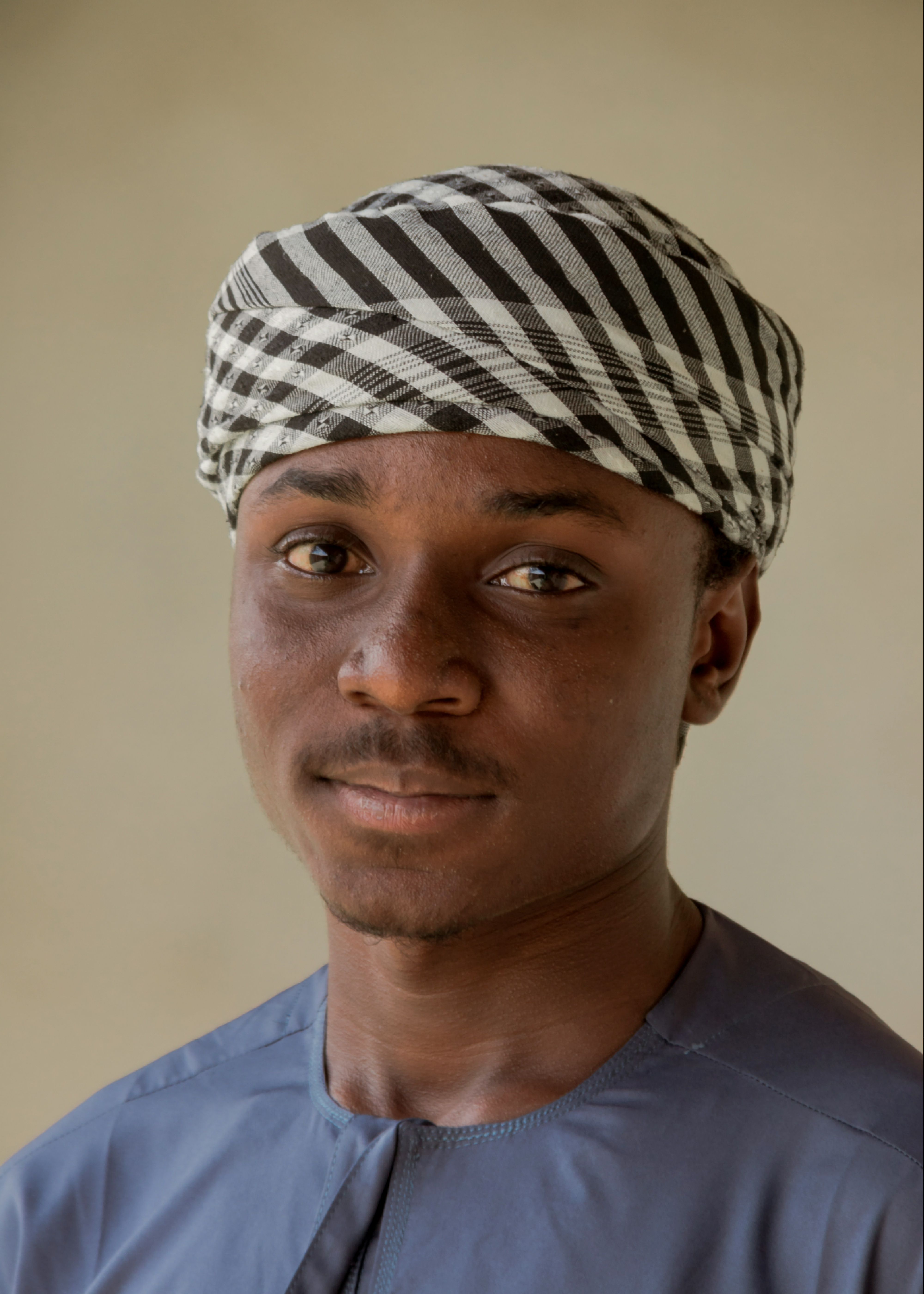 Young Man in Traditional Headwear Portrait