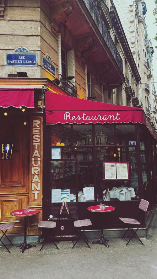 Free Explore a quaint Parisian cafe on Rue Bastien Lepage with classic outdoor seating and dining. Stock Photo