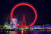 Ferris Wheel With Red Light Beside Body of Water