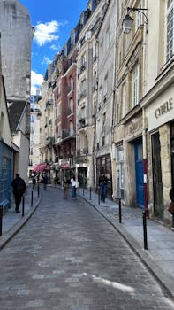 Quaint Paris street with classic architecture capturing local life and European charm.