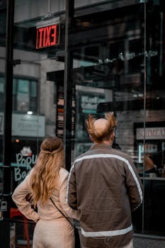 A couple overseeing the bustling streets of New York City, United States.