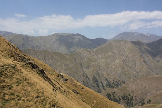Breathtaking view of rugged mountain range under a clear sky, perfect for nature and travel enthusiasts.