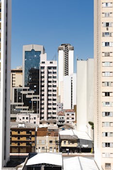 View of Curitiba's modern architecture under clear blue skies.