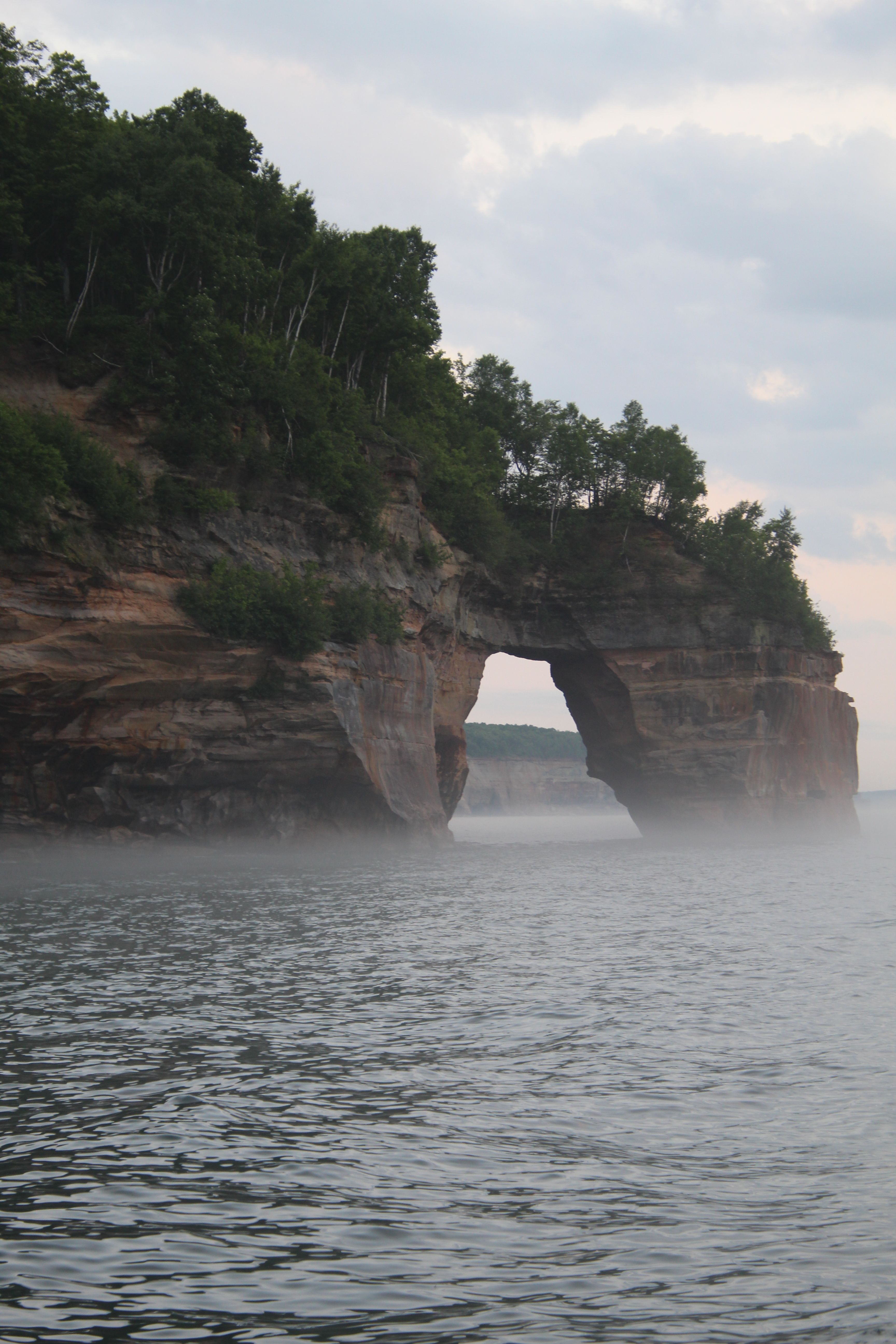 Misty Landscape of Arch at Pictured Rocks · Free Stock Photo