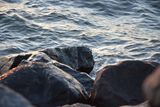 Swell breaking over shore rocks — Jakob Andersson on Pexels