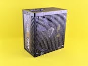Black Power Supply Unit on Yellow Background