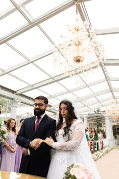 Elegant outdoor wedding ceremony in São Paulo, Brasil with chandelier decor.