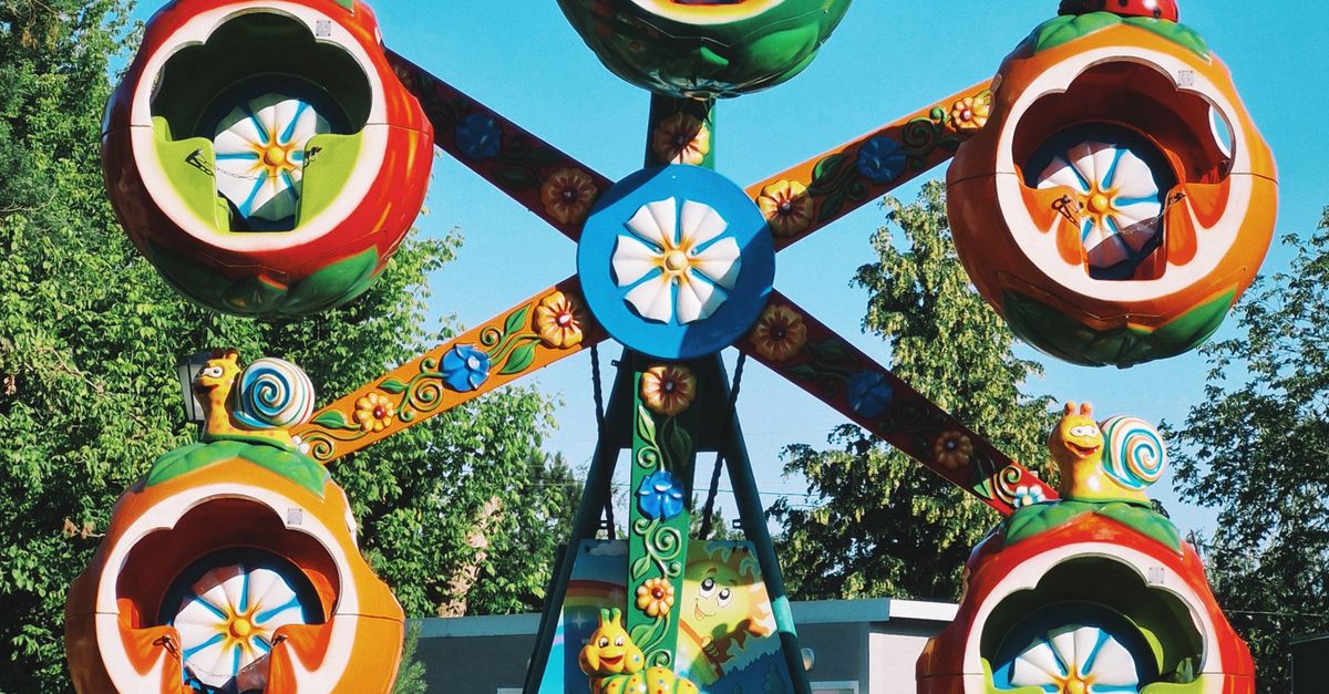 Using Children Wheel Colorful Children's Ferris Wheel in Park · Free Stock Photo