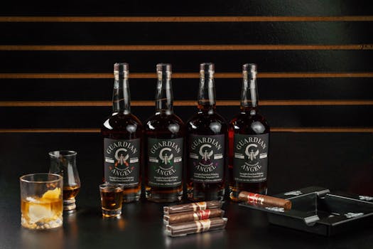 A stylish display of Guardian Angel whiskey bottles with cigars in a New Orleans bourbon bar setting.