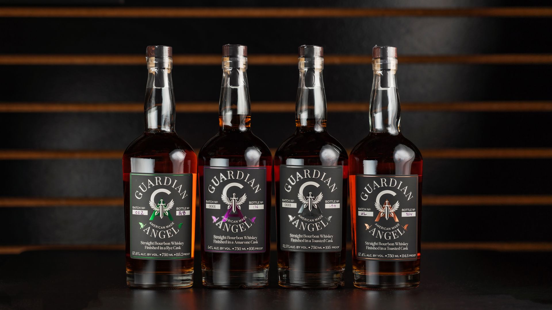 A lineup of Guardian Angel bourbon bottles displayed stylishly in a New Orleans bar.