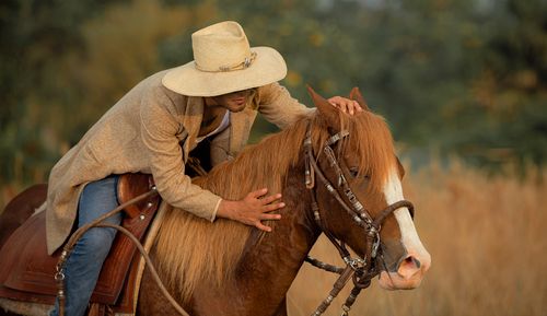 Free A cowboy in traditional attire rides a horse in Tingo María, Peru. Captured during a warm day. Stock Photo