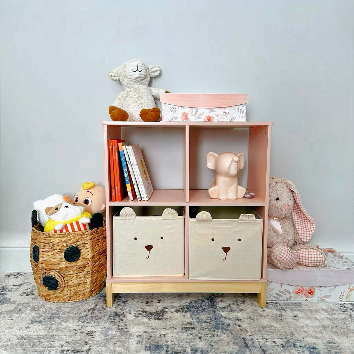 Organized children's playroom shelves with toys and books