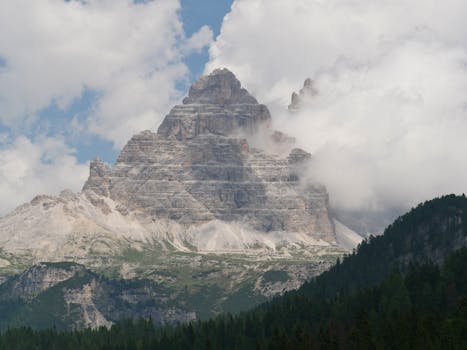 Breathtaking view of the Three Peaks in the Dolomites, South Tyrol surrounded by clouds.