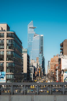 Iconic view of New York City's skyline featuring the Hudson Yards development on a clear day.