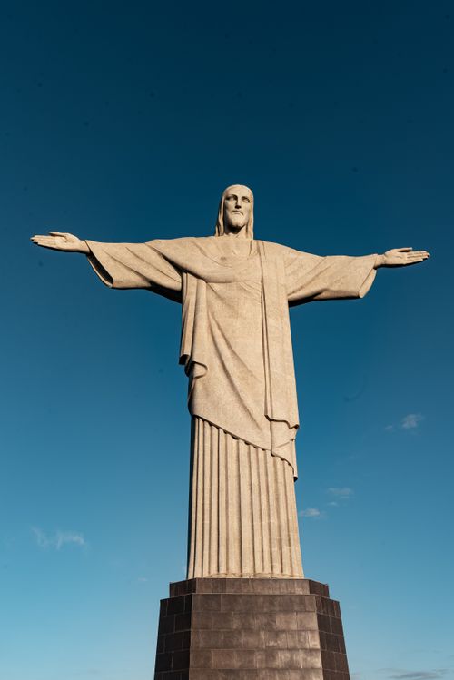 Free Iconic Christ the Redeemer statue under clear blue sky in Rio de Janeiro, Brazil. Stock Photo