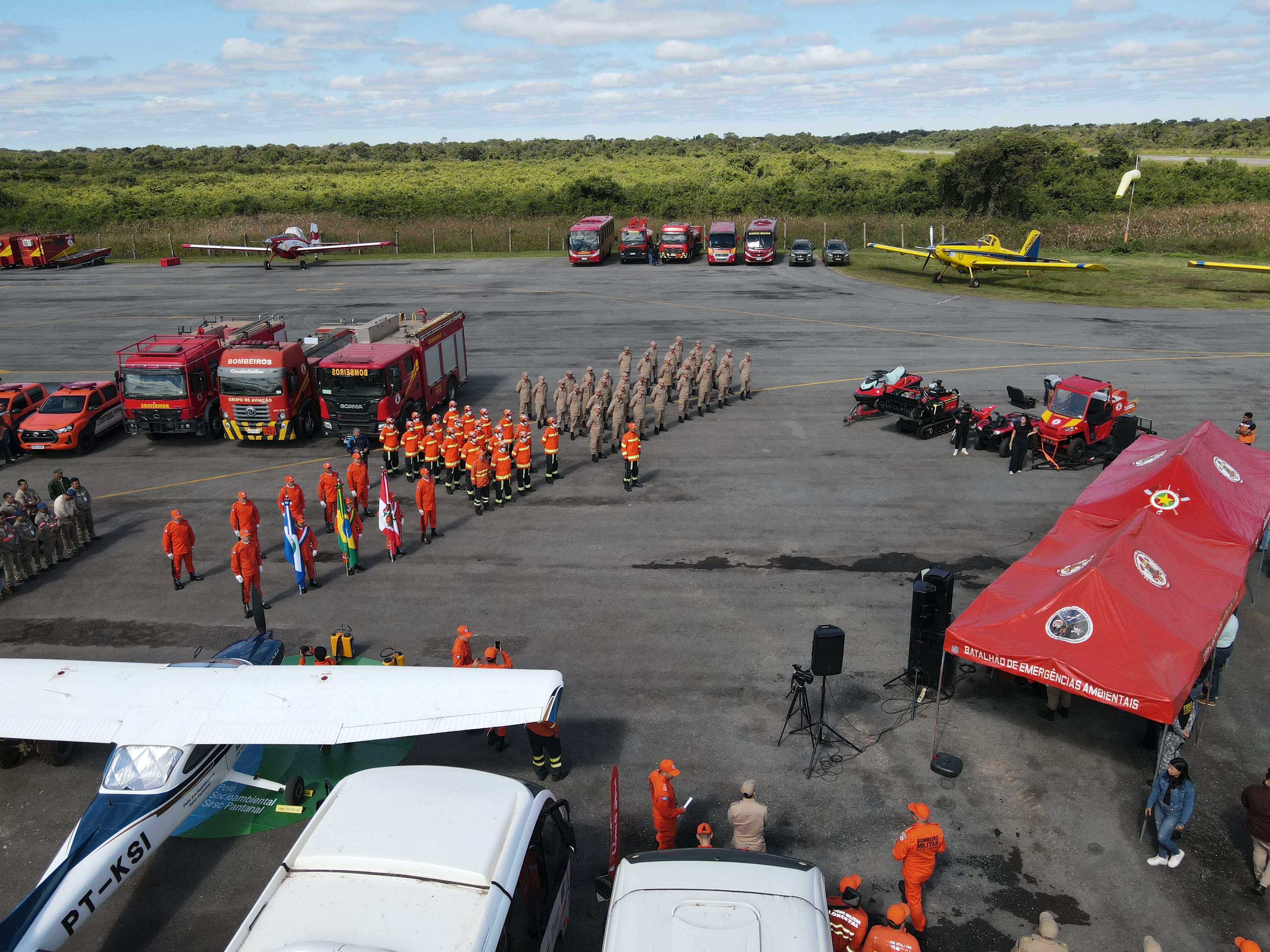 Firefighters' Assembly with Vehicles and Equipment Outdoors · Free ...