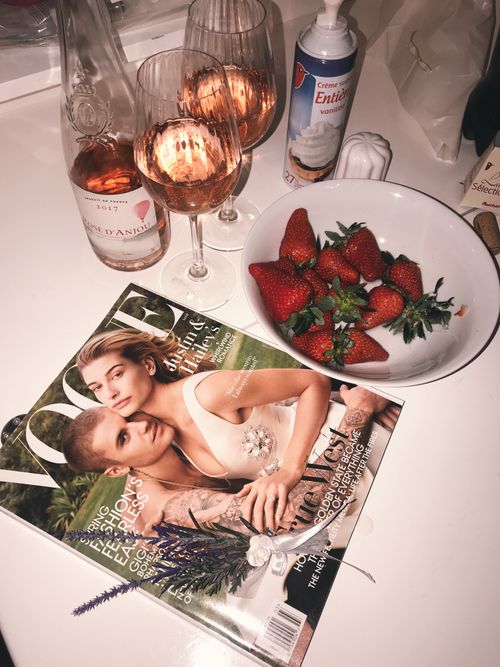 Free From above of strawberry with cream and glasses of champagne near fashion magazine Stock Photo