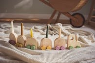 Wooden Toy Train on Cozy Blanket Indoors
