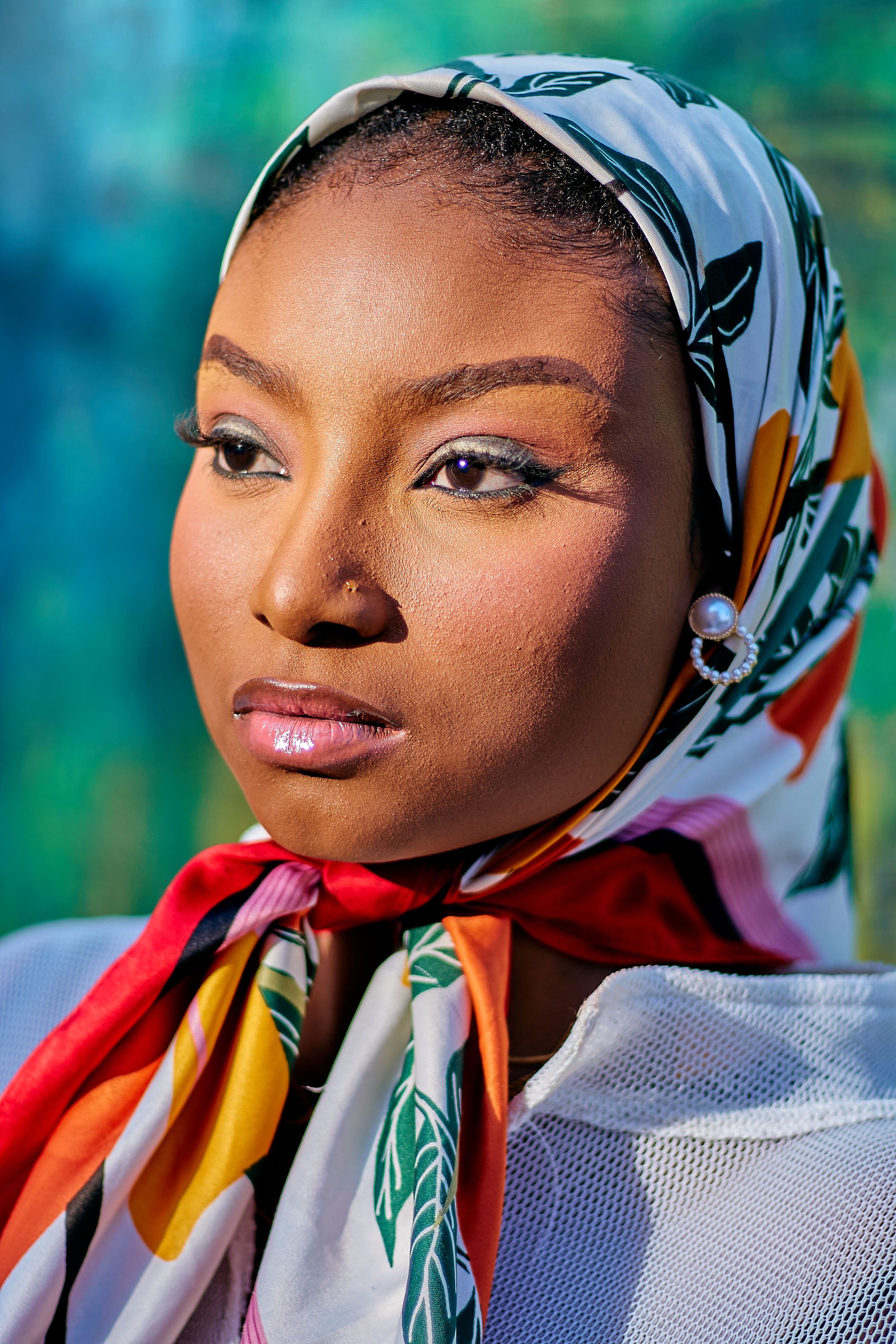 Elegant Portrait of Woman in Floral Headscarf · Free Stock Photo