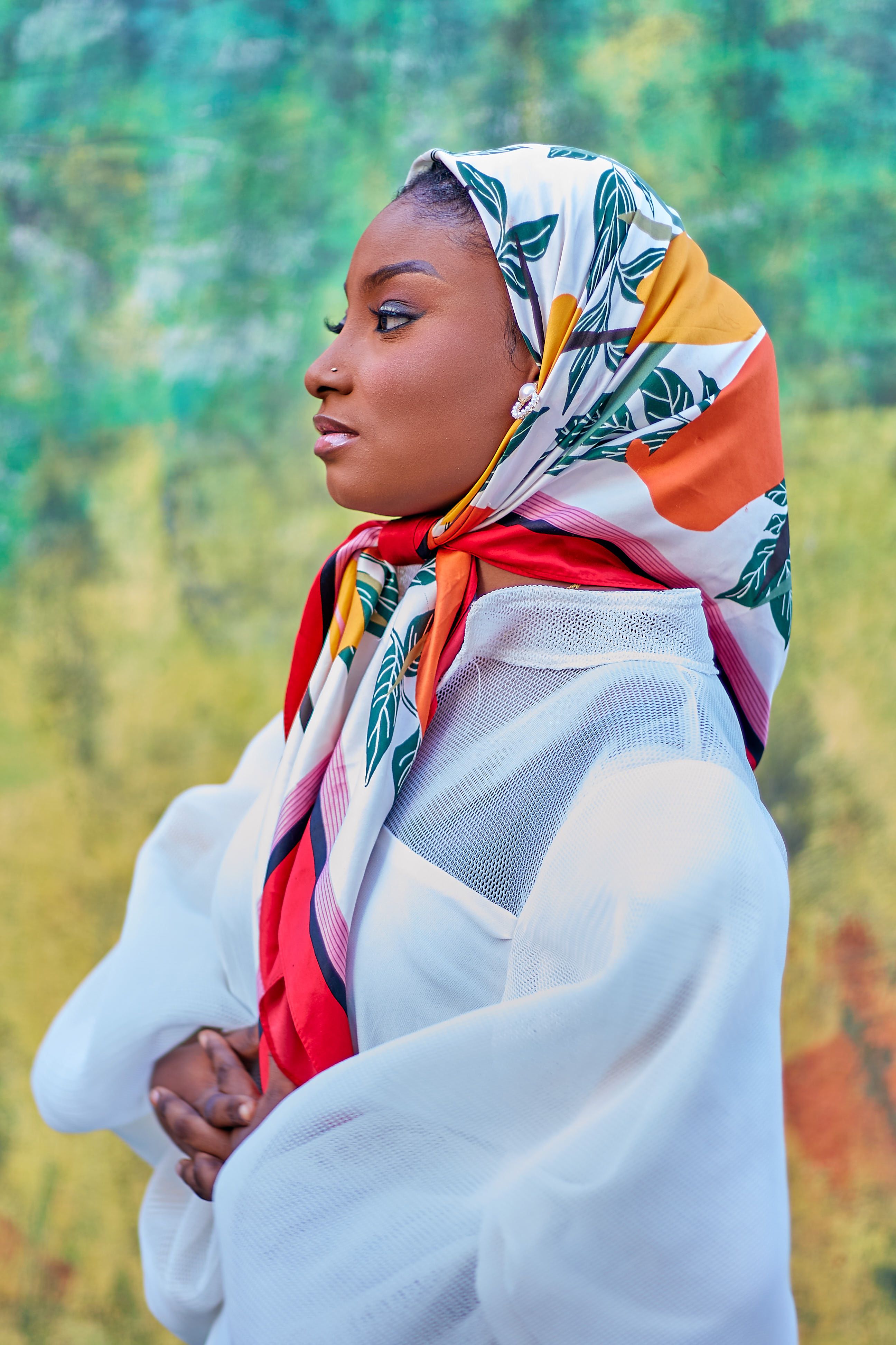 Elegant Portrait of Woman in Colorful Headscarf · Free Stock Photo