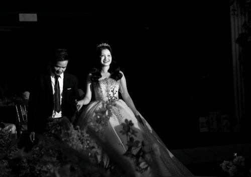 Free A joyful couple dressed in formal attire at a glamorous event, captured in black and white. Stock Photo