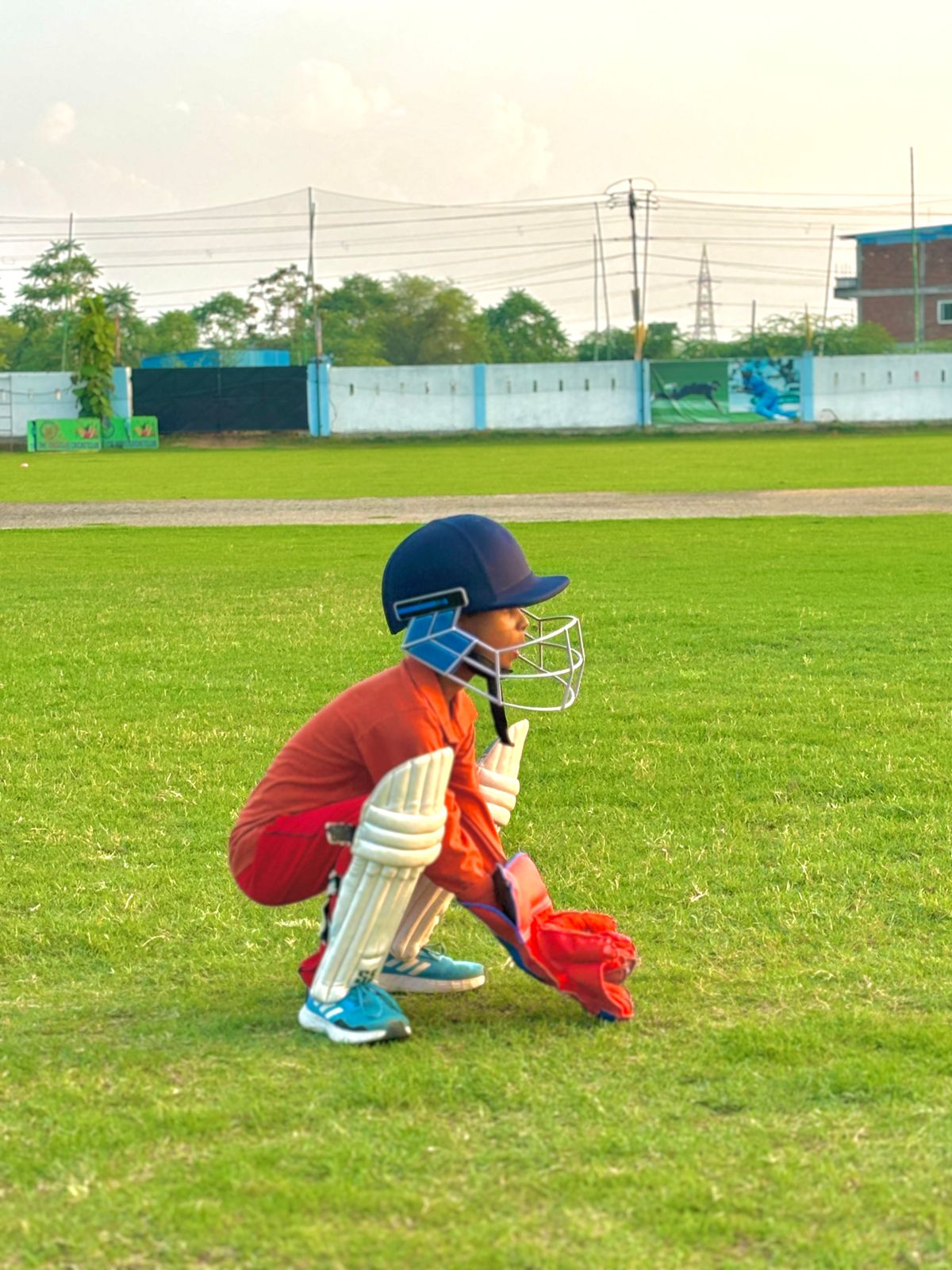 A fielder in position during a cricket match