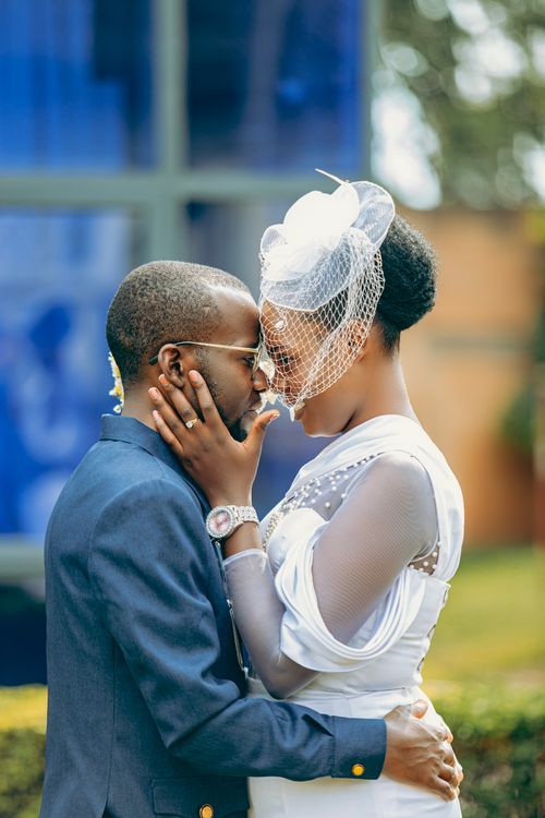 Free A loving couple shares an intimate moment on their wedding day in Bujumbura, Burundi. Stock Photo