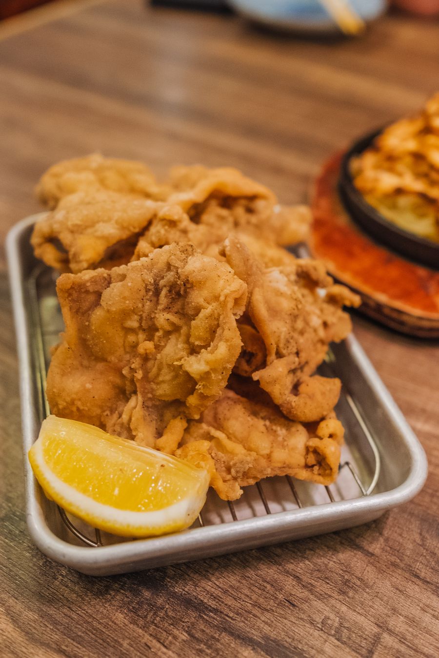 Golden fried chicken on a metal tray, photo by Richard L on Pexels